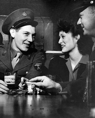 Girl with WWII Soldiers at Sea Grill, Washington DC, 1943 by McMaha